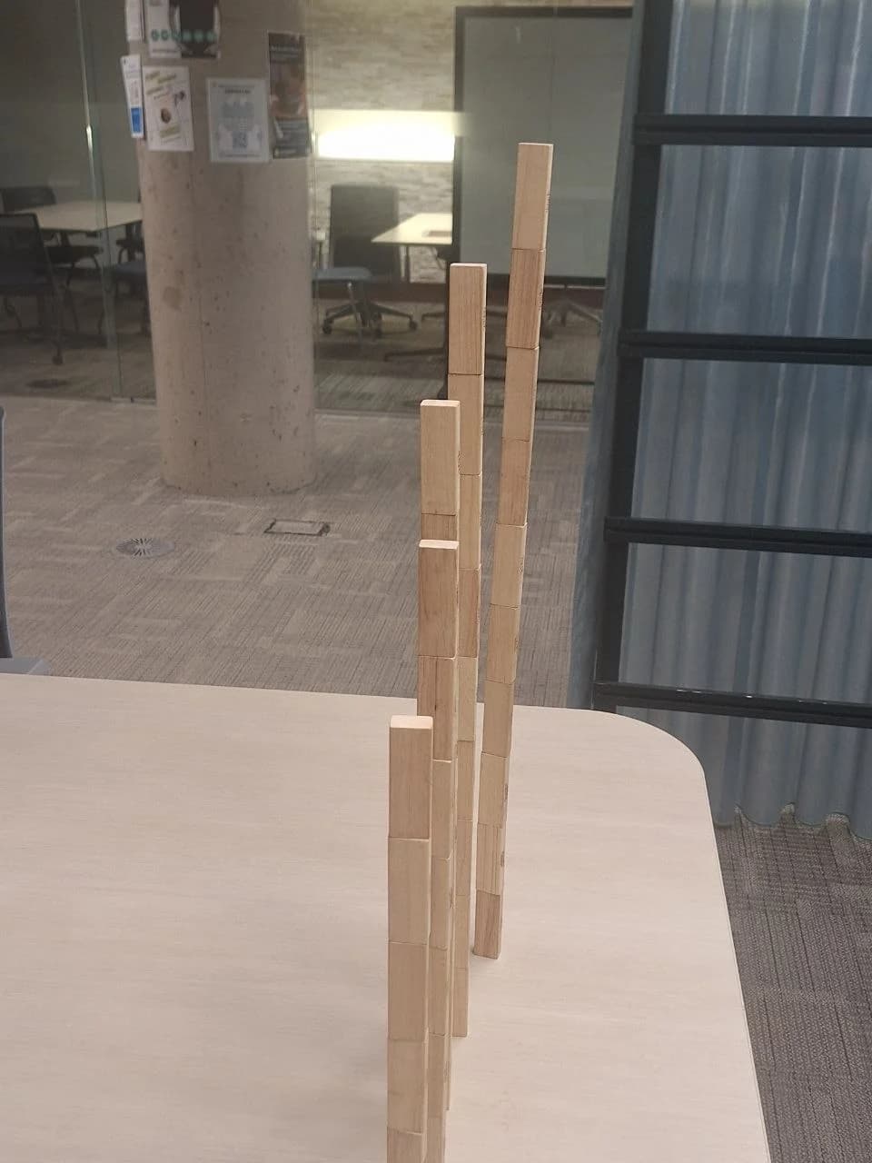 A carefully balanced tower of wooden blocks