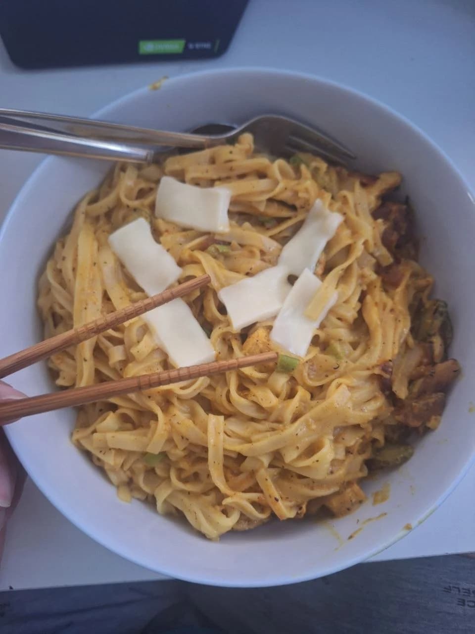 A bowl of pasta at the table