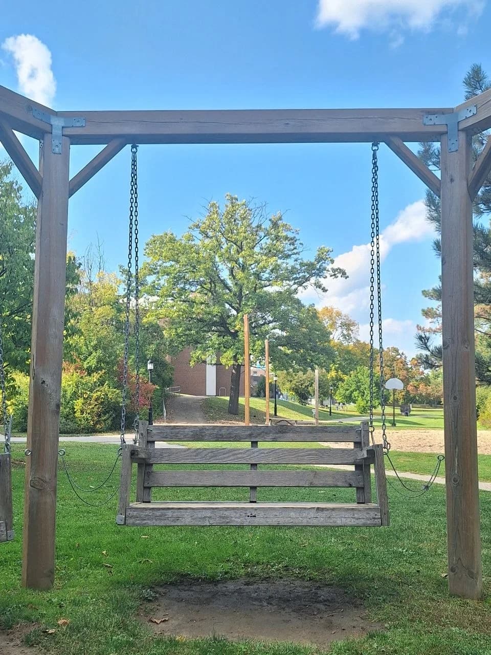 A park swing beneath a blue sky
