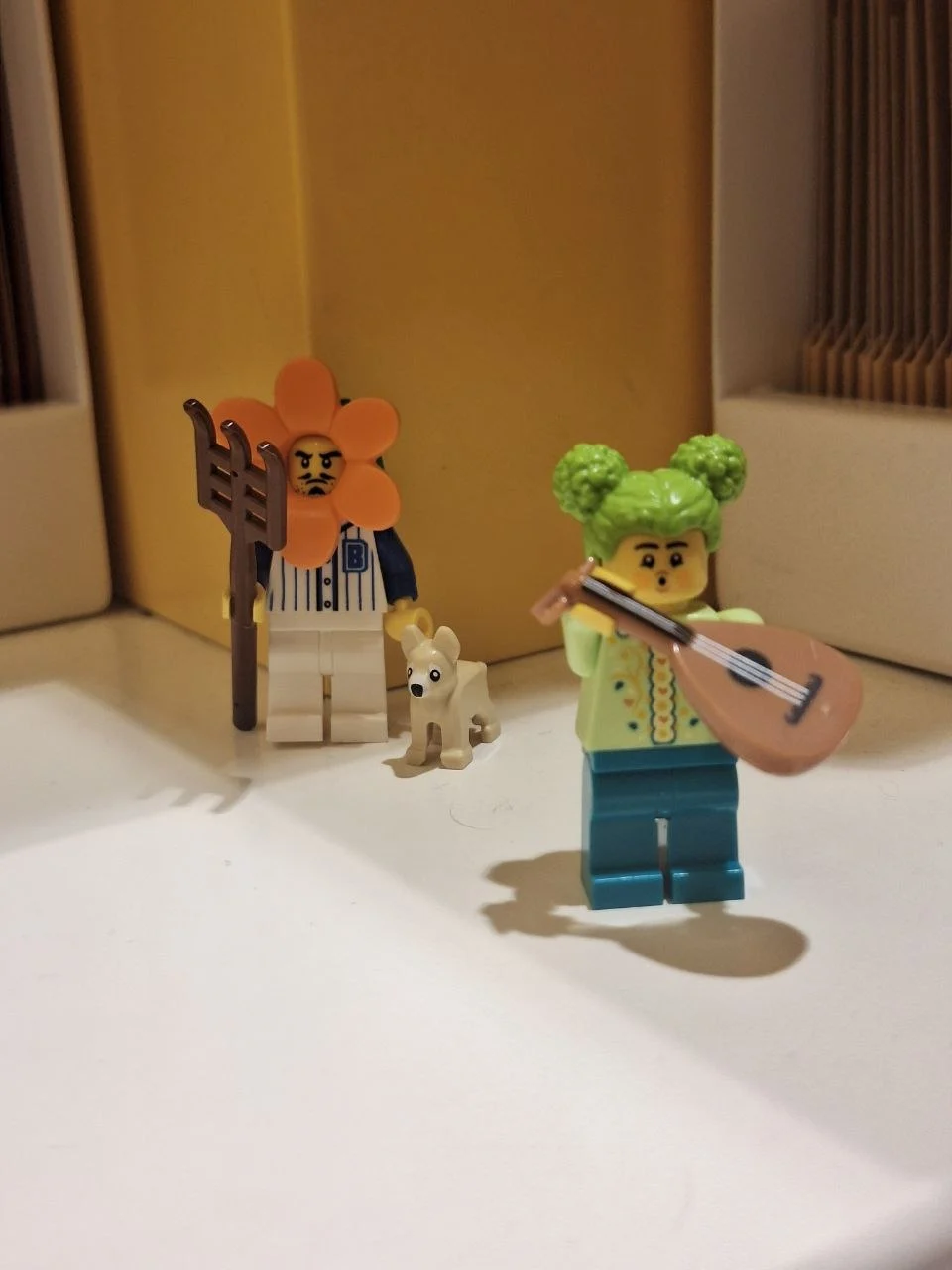 A row of little Lego figures by a window